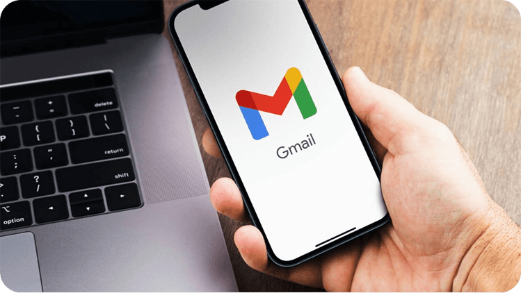 Hand holding phone with Gmail open